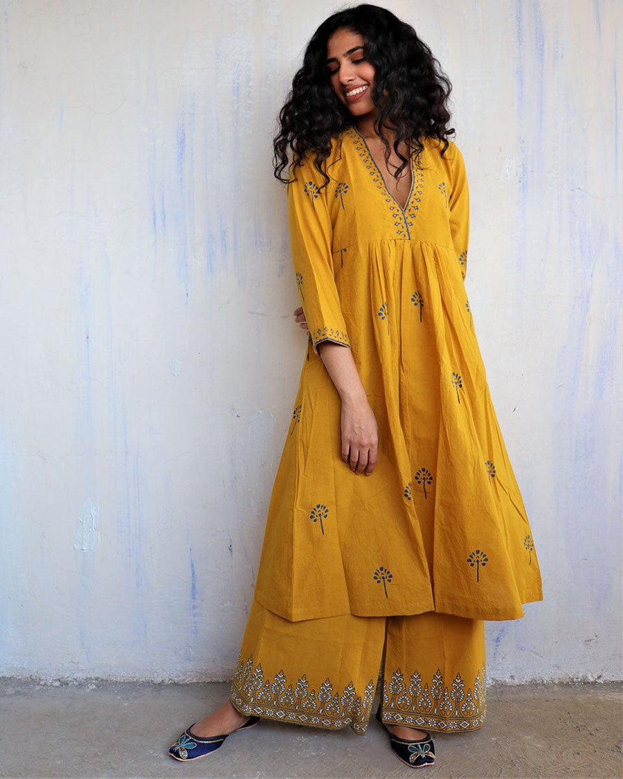 Women Mustard Ornamental Printed Kurta With Trouser